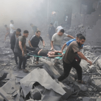 Palestinians evacuate wounded after an Israeli airstrike in Rafah refugee camp, Southern Gaza Strip, October 12,2023. (Photo: AP/Hatam Ali)